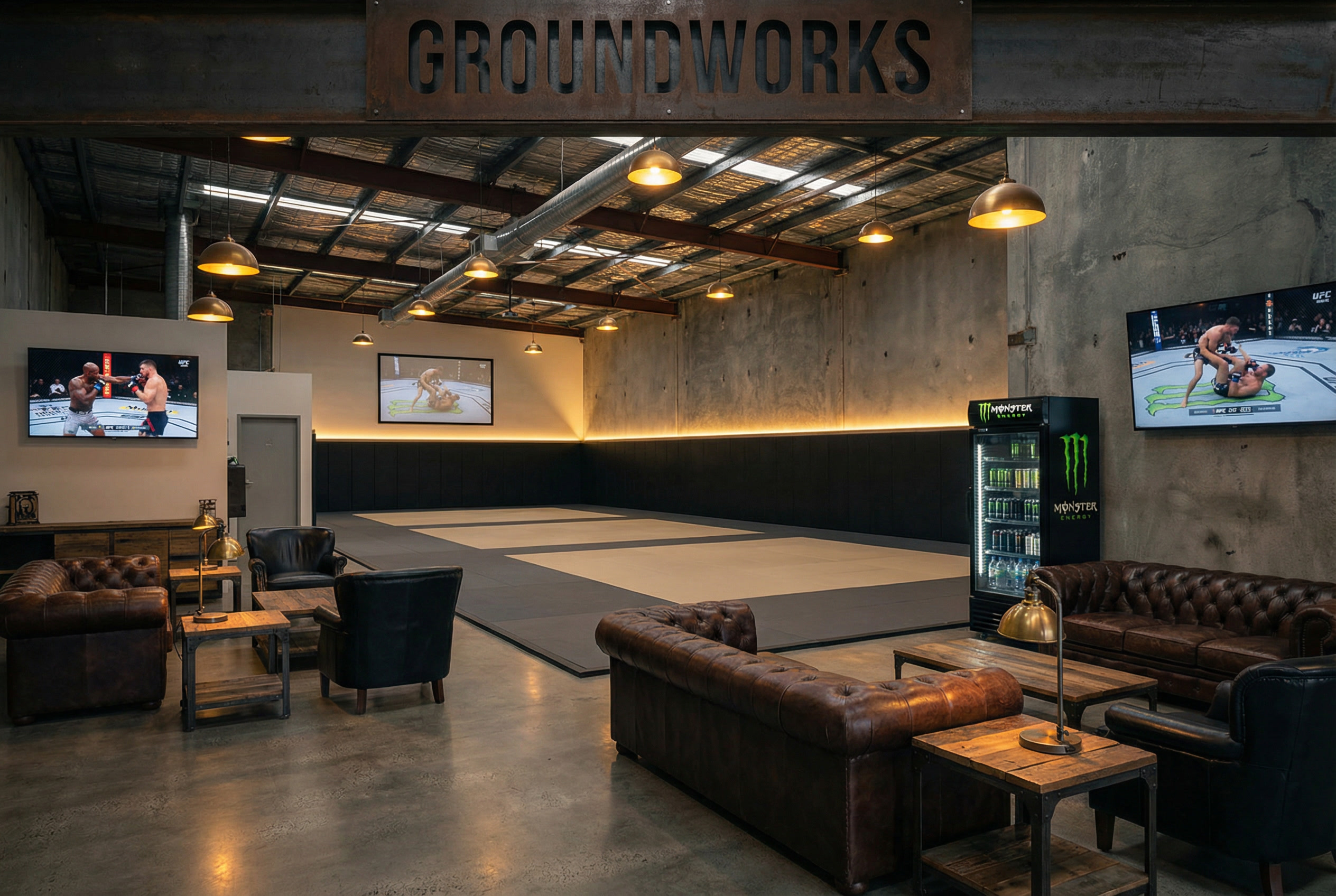 Entryway under a forged GROUNDWORKS steel sign with Chesterfield sofas and fight screens